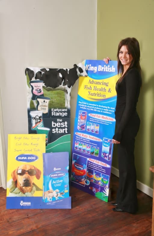 woman standing with custom printed show cards